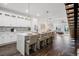 Modern kitchen with white cabinets, quartz countertops, an island with seating, and stainless steel appliances at 6206 64Th N Way, Pinellas Park, FL 33781