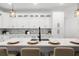 Kitchen island with quartz countertops, seating, and white cabinets at 6206 64Th N Way, Pinellas Park, FL 33781