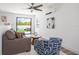 Bright living room with sleek ceiling fan, comfortable seating, and sliding glass doors opening to a private patio at 6206 64Th N Way, Pinellas Park, FL 33781
