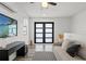 Modern living room with sleek floors, black console, TV, and comfortable seating at 6206 64Th N Way, Pinellas Park, FL 33781
