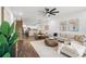 Open-concept living room blending contemporary design with hardwood floors, a modern kitchen, and comfortable seating at 6206 64Th N Way, Pinellas Park, FL 33781