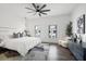 Bright main bedroom features modern ceiling fan, two windows and gray accents at 6206 64Th N Way, Pinellas Park, FL 33781