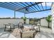 This cozy outdoor patio boasts modern seating, a fan, and a view at 6206 64Th N Way, Pinellas Park, FL 33781