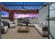 Picturesque outdoor patio featuring a pergola, comfortable seating, and vibrant floral accents at 6206 64Th N Way, Pinellas Park, FL 33781