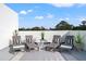 Outdoor patio with stylish lounge chairs, offering a perfect spot for relaxation and enjoyment at 6206 64Th N Way, Pinellas Park, FL 33781