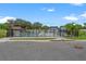 Community pool area features a sleek fence, providing security and a clear view of the water at 6206 64Th N Way, Pinellas Park, FL 33781