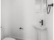 Powder room with a pedestal sink and modern fixtures at 6206 64Th N Way, Pinellas Park, FL 33781