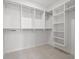 Spacious walk-in closet with custom shelves and rods at 6206 64Th N Way, Pinellas Park, FL 33781