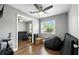 Spacious bedroom with mirrored closet doors, hardwood flooring, and ample natural light at 6212 S Adelia Ave, Tampa, FL 33616