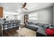 Inviting living space with a gray couch, dark wood floors, and modern ceiling fan at 6212 S Adelia Ave, Tampa, FL 33616