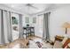 Bright office space featuring hardwood flooring, a desk, and an abundance of natural light at 650 63Rd S Ave, St Petersburg, FL 33705