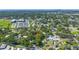 Aerial view of the neighborhood with the home surrounded by mature trees at 6505 Cedar Ne St, St Petersburg, FL 33702