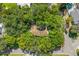 Aerial view of the home surrounded by mature trees and a large yard at 6505 Cedar Ne St, St Petersburg, FL 33702