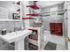Stylish bathroom with marble tile, red accents, and a modern sink at 6505 Cedar Ne St, St Petersburg, FL 33702