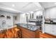 Bright, updated kitchen featuring an island, stainless steel appliances, and white cabinets at 6505 Cedar Ne St, St Petersburg, FL 33702
