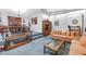 Cozy living area featuring a fireplace, comfortable seating, and an open layout to the dining space at 6505 Cedar Ne St, St Petersburg, FL 33702