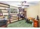 Functional office space with built-in shelving, a desk, and a comfortable chair at 6505 Cedar Ne St, St Petersburg, FL 33702