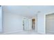 Bright bedroom featuring neutral walls, carpeted floors, and access to an ensuite bathroom and walk-in closet at 7077 Woodchase Glen Dr, Riverview, FL 33578