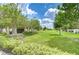 Expansive community park with lush greenery, walking paths, and a convenient mailbox station at 7077 Woodchase Glen Dr, Riverview, FL 33578