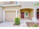 Well-maintained townhome with a private garage and welcoming front entrance at 7077 Woodchase Glen Dr, Riverview, FL 33578