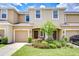 Charming townhome with a well-maintained lawn and beautiful landscaping at 7077 Woodchase Glen Dr, Riverview, FL 33578