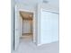 Hallway with access to multiple rooms and a closet with sliding doors at 7077 Woodchase Glen Dr, Riverview, FL 33578