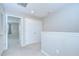 Upstairs hallway with carpet, recessed lighting, a linen closet, and bedroom doorways at 7077 Woodchase Glen Dr, Riverview, FL 33578