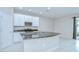 Well-equipped kitchen with an island, stainless appliances, and ample cabinetry at 7077 Woodchase Glen Dr, Riverview, FL 33578