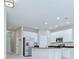 Bright kitchen with stainless steel appliances and recessed lighting at 7077 Woodchase Glen Dr, Riverview, FL 33578