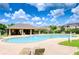 Beautiful community pool with lounge chairs for relaxing in the sun on a clear day at 7077 Woodchase Glen Dr, Riverview, FL 33578