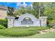 Elegant stone community sign amidst beautiful landscaping, welcoming residents and guests at 7077 Woodchase Glen Dr, Riverview, FL 33578