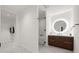 Open bathroom layout with walk-in closet, stylish vanity, and glass-enclosed shower at 777 3Rd N Ave # 1406, St Petersburg, FL 33701