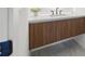 Modern bathroom vanity with wood grain cabinetry and white countertop at 777 3Rd N Ave # 1406, St Petersburg, FL 33701