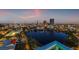 Breathtaking city skyline view featuring lit buildings and a calm lake, enjoyed from a high-rise balcony at 777 3Rd N Ave # 1406, St Petersburg, FL 33701