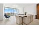 Bright dining area showcases a marble top dining table and flows into an airy living space at 777 3Rd N Ave # 1406, St Petersburg, FL 33701