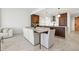 Bright dining area showcases a marble top dining table and flows into a modern kitchen space at 777 3Rd N Ave # 1406, St Petersburg, FL 33701