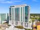 Modern high-rise condominium with glass windows and private balconies offering amazing city views under a clear blue sky at 777 3Rd N Ave # 1406, St Petersburg, FL 33701