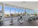 Modern fitness center with state-of-the-art equipment and floor-to-ceiling windows offering panoramic city views at 777 3Rd N Ave # 1406, St Petersburg, FL 33701
