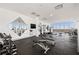 Bright gym with top-of-the-line equipment, mirrored walls, and floor-to-ceiling windows at 777 3Rd N Ave # 1406, St Petersburg, FL 33701