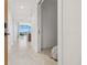 Modern condo hallway with sleek tile flooring and access to living spaces at 777 3Rd N Ave # 1406, St Petersburg, FL 33701