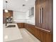 Sleek kitchen design with built-in appliances, wood accents, and ample counter space at 777 3Rd N Ave # 1406, St Petersburg, FL 33701