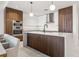 Sophisticated kitchen with a central island, stylish cabinets, and stainless steel double ovens at 777 3Rd N Ave # 1406, St Petersburg, FL 33701