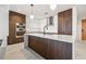 Elegant kitchen with a central island, sleek cabinetry, and modern stainless steel appliances at 777 3Rd N Ave # 1406, St Petersburg, FL 33701