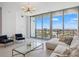 Bright living room with floor-to-ceiling windows and modern furnishings at 777 3Rd N Ave # 1406, St Petersburg, FL 33701