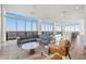 Bright lounge area with a sectional sofa and floor-to-ceiling windows at 777 3Rd N Ave # 1406, St Petersburg, FL 33701