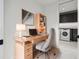 Home office space with built-in desk, storage, and a laundry room nearby at 777 3Rd N Ave # 1406, St Petersburg, FL 33701