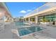 Rooftop pool and spa with lounge chairs and lush landscaping at 777 3Rd N Ave # 1406, St Petersburg, FL 33701