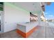 Chic poolside bar area with sleek countertops and ample space for entertaining by the refreshing pool at 777 3Rd N Ave # 1406, St Petersburg, FL 33701