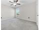 Neutral bedroom features carpet, a ceiling fan, window with a view and natural light at 797 Olive Conch St, Ruskin, FL 33570