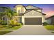 Charming two-story home with a two-car garage and well-maintained landscaping at 797 Olive Conch St, Ruskin, FL 33570
